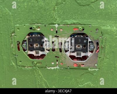 Wall Electrical Boxes And Wiring. Open Electrical Compartments On Painted Wall With Visible Cables Stock Photo