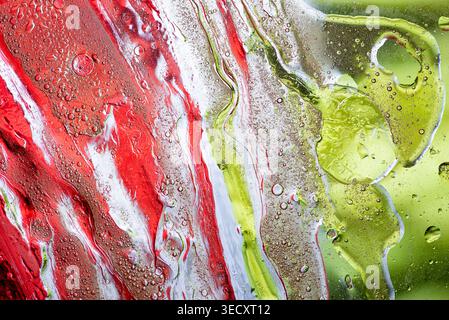 Dreamy abstract fluid art background with flowing pink white and green colors creating soft organic shapes and textures. Stock Photo