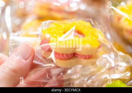 Wrapped Easter Cookie Sandwiches in Basket Stock Photo