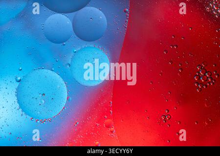 Abstract Colorful Food Oil Drops Bubbles and spheres Flowing on Water Stock Photo