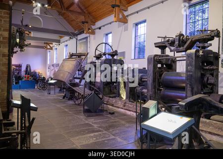 Charleroi, Belgium - 24 Jul 24: Wide interior view of historic industrial machines and exhibits in a museum hall at Bois du Cazier, Charleroi, Belgium Stock Photo