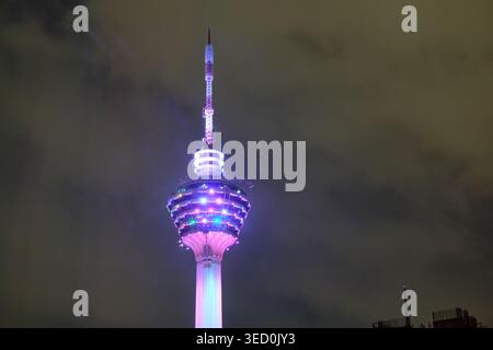 Menara KL telecommunications tower at night with colorful illumination against Kuala Lumpur skyline. High quality photo Stock Photo