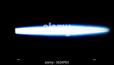 horizontal neon laser ray for overlay design bright cyan light streak isolated on black futuristic glow flare fast speed motion concept Stock Photo