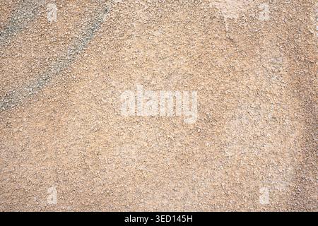 Close up of wall finished with very small natural stones texture Stock Photo