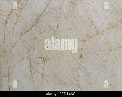 Earthy rustic allure. Natural textured stone finish. Vintage style marble with rustic charm for homes. Handcrafted beige stone featuring distinctive Stock Photo