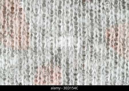 Knitted light woolen fabric pattern with grey, white and pink color Stock Photo