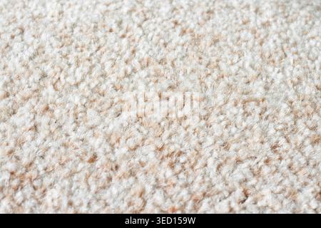 Textured soft light brown fabric carpet with villi macro Stock Photo