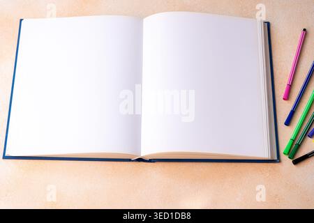 Open Sketchbook With Colorful Markers top view copy space background. Notebook album book place for text Stock Photo