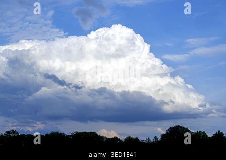 White cumulus congestus cloud / towering cumulus developing into cumulonimbus capable of causing thunderstorms and rain showers of heavy intensity Stock Photo