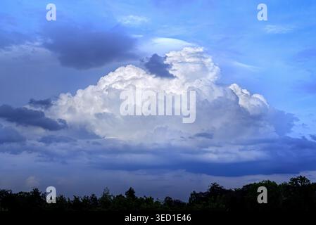 White cumulus congestus cloud / towering cumulus developing into cumulonimbus capable of causing thunderstorms and rain showers of heavy intensity Stock Photo