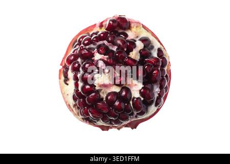 Pomegranate cut open showcasing red seeds inside the fruit Stock Photo