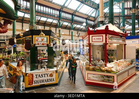 Ornate Victorian interior of Leeds Kirkgate Market featuring a historic market stalls, Leeds, West Yorkshire, England, UK Stock Photo