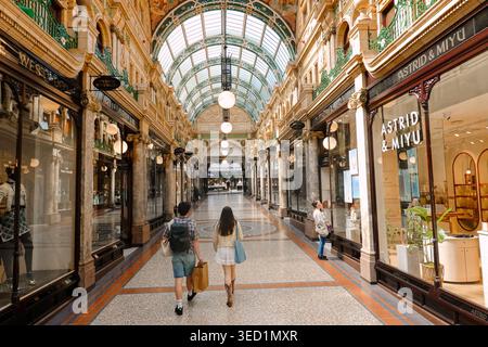 Shoppers walking through the ornate County Arcade in the Victoria Quarter, a luxury shopping destination in Leeds city centre, West Yorkshire, UK Stock Photo