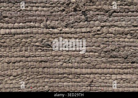 Close-up view of textured woven fabric reveals complex patterns and rich colors. Stock Photo