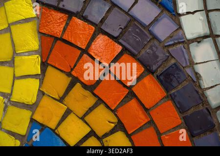 Vibrant multi colored ceramic mosaic tiles in a decorative pattern Stock Photo