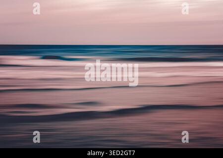 Dreamy pastel ocean waves in soft motion blur Stock Photo