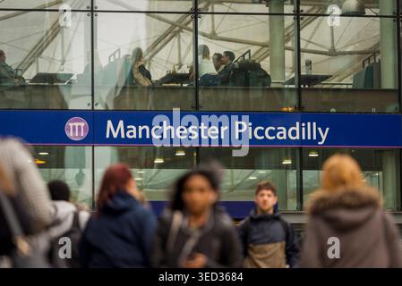 Commuters walking outside Manchester Piccadilly railway station in Manchester, England, UK Stock Photo