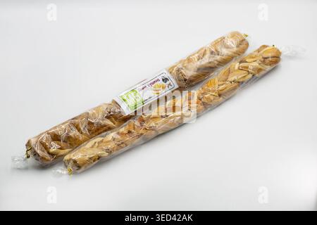 Kyiv, Ukraine - March 22, 2026: Studio shot of braided dried melon snacks wrapped in clear plastic with label. Natural sweet fruit product closeup on Stock Photo