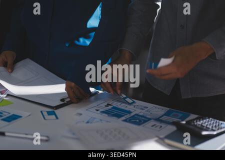 Team of Program Developer Collaborating on UXUI Design Planning in a Modern Office Environment Stock Photo