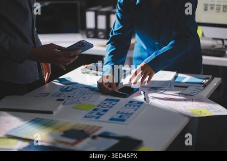 Team of Program Developer Collaborating on UXUI Design Planning in a Modern Office Environment Stock Photo