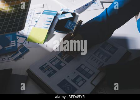 Team of Program Developer Collaborating on UXUI Design Planning in a Modern Office Environment Stock Photo