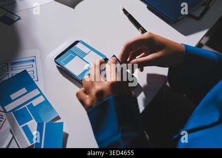 Team of Program Developer Collaborating on UXUI Design Planning in a Modern Office Environment Stock Photo
