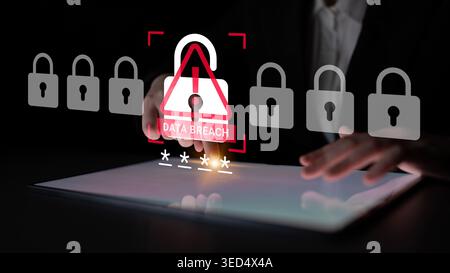 A businessman interacts with a tablet displaying a data breach alert graphic, emphasizing the importance of cybersecurity and digital protection in a Stock Photo