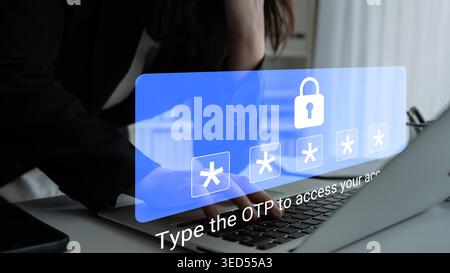 A woman focuses on her laptop screen, entering a one-time password surrounded by a digital lock graphic, emphasizing the importance of online security Stock Photo