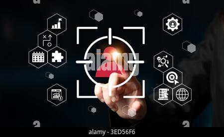 A close-up of a hand interacting with a digital touchscreen interface highlighting user profiles and business analytics, showcasing modern technology Stock Photo