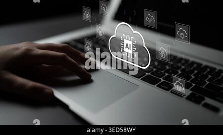 A hand on a laptop keyboard with cloud computing icons representing artificial intelligence and digital technology innovation in contemporary business Stock Photo