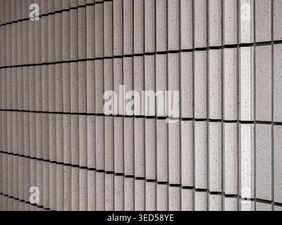 Abstract ceramic tile wall texture with repeating geometric pattern and clean architectural lines. Minimal modern surface design creating rhythmic str Stock Photo