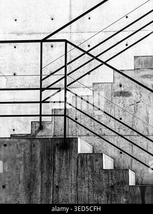 A detail of an unremarkable structural element of an anonymous building shows the staircase in a modern building. Stock Photo