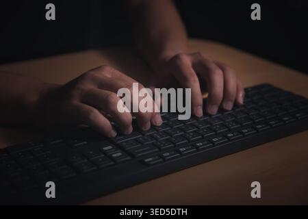 Man's hands using a computer keyboard to searching for information. Searching browsing internet data information with computer keyboard. Using search Stock Photo