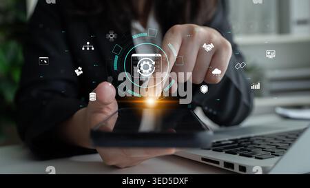 Professional using smartphone with digital interface displaying technology icons for data analysis and communication in modern workspace setting Quark Stock Photo