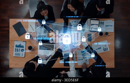 A top-down view of a business meeting focused on cybersecurity, showcasing digital locks and data streams, highlighting the importance of data Stock Photo