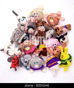 Various knitted woolen toys on a white background Stock Photo