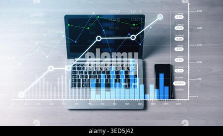 A modern workspace featuring a laptop and smartphone, showcasing financial growth insights through vivid graphs and data analytics, symbolizing Stock Photo