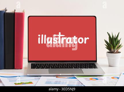The word illustrator on laptop screen, placed on a desk with documents and books. Illustrator or graphic designer creative occupation or job concept. Stock Photo