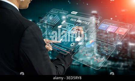 Business Professional Interacting with Advanced Data Analytics Interfaces Featuring Visual Graphs and AI Technology Fluxor. Stock Photo