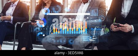 Business professionals using smartphones in a modern office setting with digital data charts and analytics overlay on a bright background Sigmoid Stock Photo