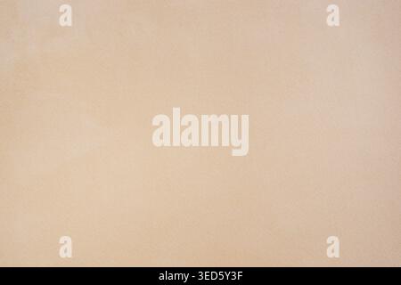 Minimal beige textile texture with fine woven pattern, soft neutral background ideal for fabric design, interior concepts, and clean abstract backdrop Stock Photo
