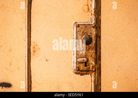 Rusted metal door lock and handle close-up, selective focus Stock Photo