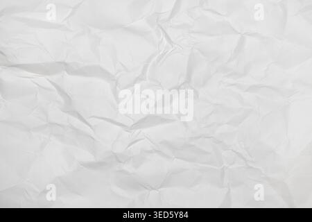 Texture of crumpled white paper as background, top view Stock Photo
