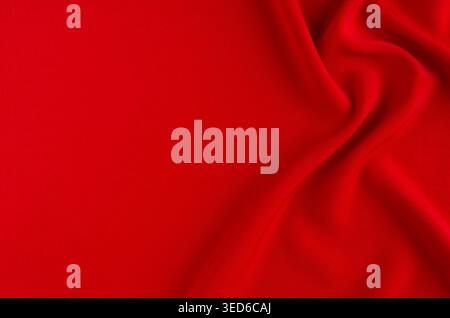 Deep red silk smooth background with copy space. Abstract love backdrop. Stock Photo