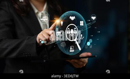 Business professional interacting with futuristic technology displaying global networking and digital communication concepts on a transparent screen Stock Photo