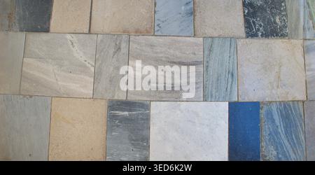 Natural stone tile wall with mixed marble textures in neutral tones. Ideal for background, wallpaper, banner or copy space. Abstract background. Stock Photo