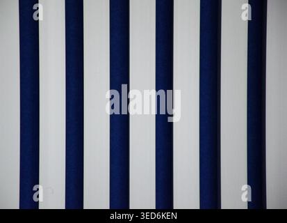Abstract blue and white vertical striped pattern background with clean geometric design. Minimal modern wallpaper, parallel lines, symmetry. Stock Photo