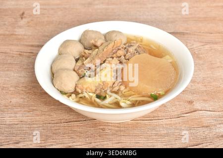 boiled meatball and braised beef meat tendon with bean sprout in clear soup on bowl Stock Photo