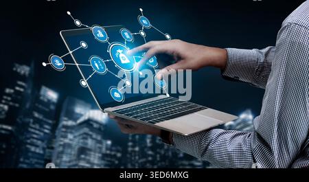 A professional interacts with a futuristic security interface on a laptop, set against a stunning urban skyline, symbolizing technology and innovation Stock Photo