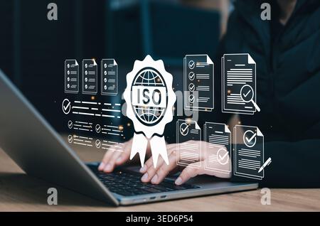 ISO certification compliance and quality audit concept. professional using laptop with virtual approved documents, checklists, verification badge, Stock Photo
